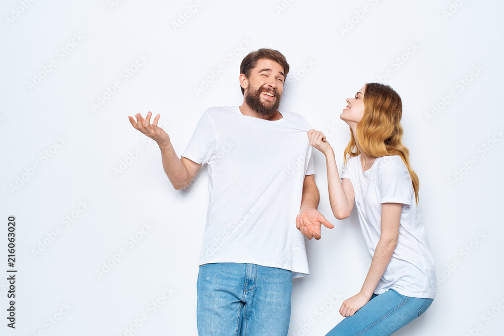 young couple in white t-shirts young couple in white t-shirts