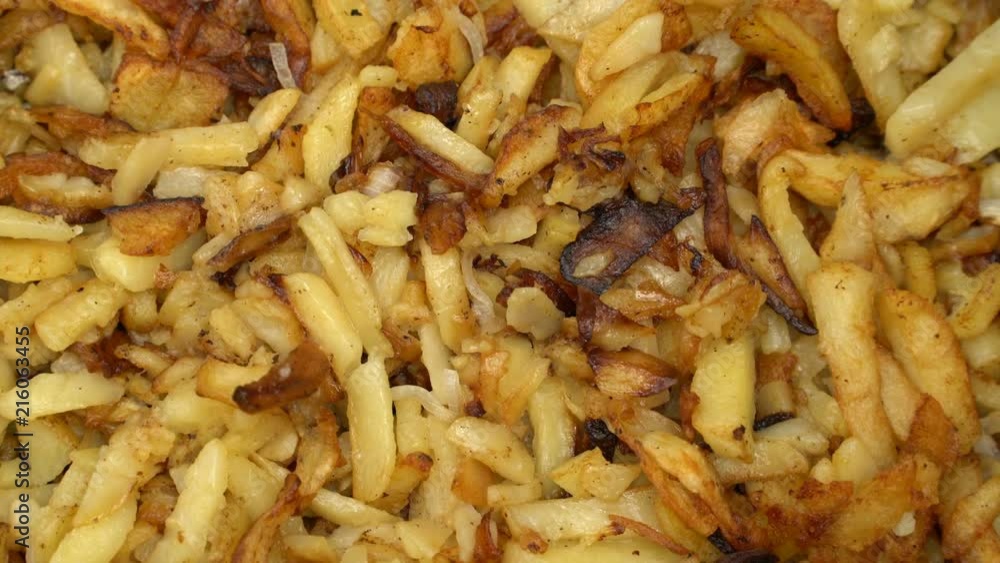 Fried potatoes in a frying pan rotate Fried potatoes in a frying pan rotate