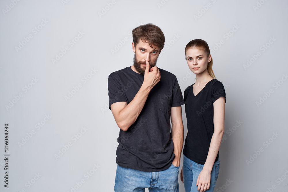 young couple in black T-shirts logo style young couple in black T-shirts logo style