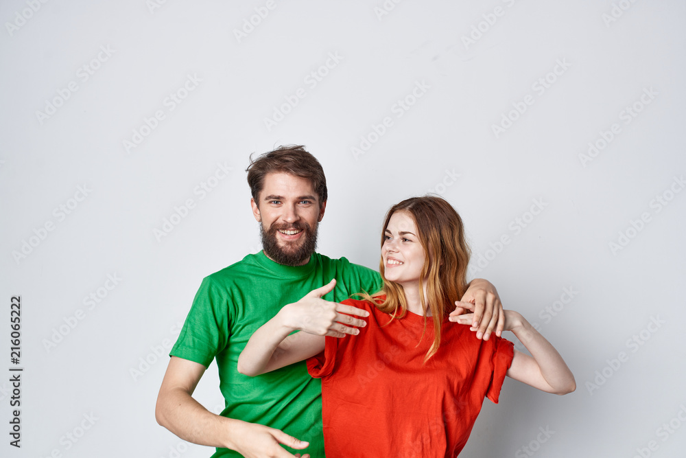 Fototapeta premium young couple in colored t-shirts