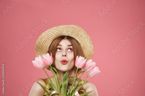 holiday spring woman in a hat with flowers march