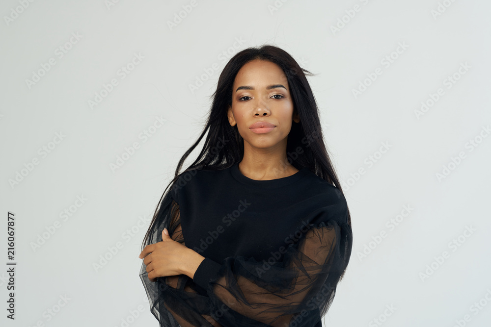 Fototapeta premium African woman on bright isolated background portrait