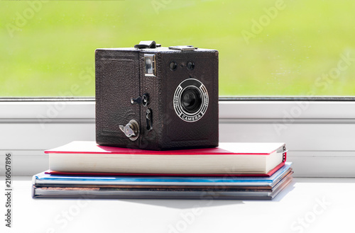 classic film camera on books
