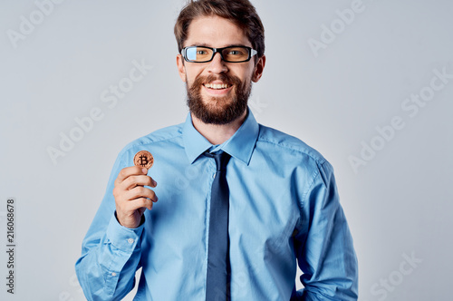 business man in glasses with bitcoin finance