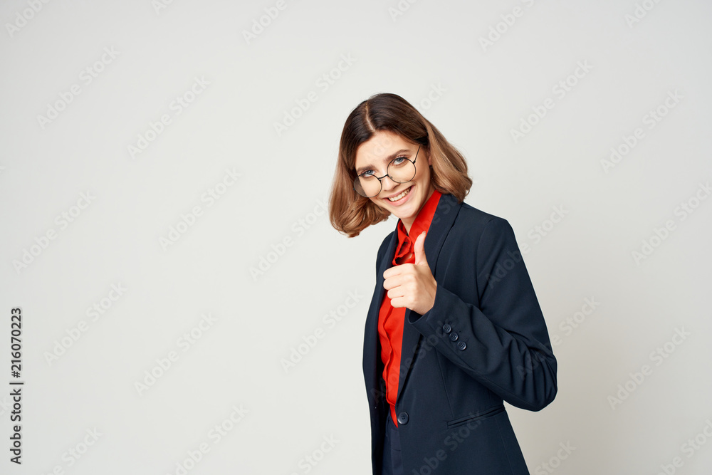 business woman with glasses smiling showing thumbs up business woman with glasses smiling showing thumbs up