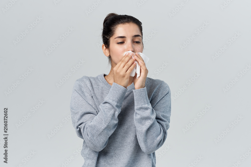 woman with a handkerchief runny flu woman with a handkerchief runny flu