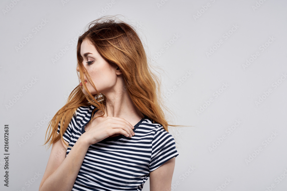 red-haired woman on a light background beauty red-haired woman on a light background beauty