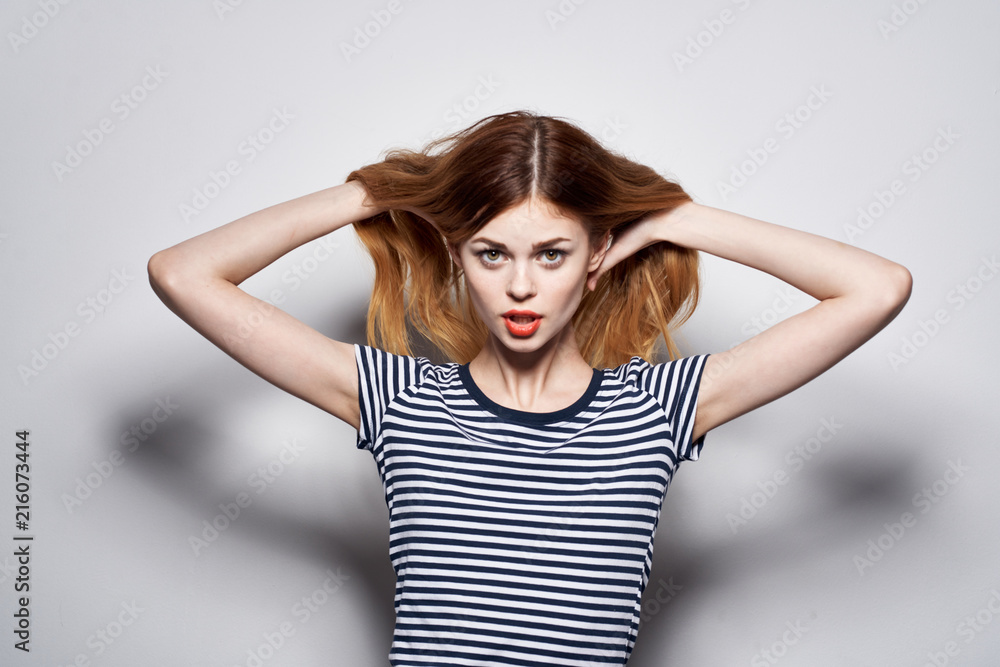 woman straightens hair woman straightens hair
