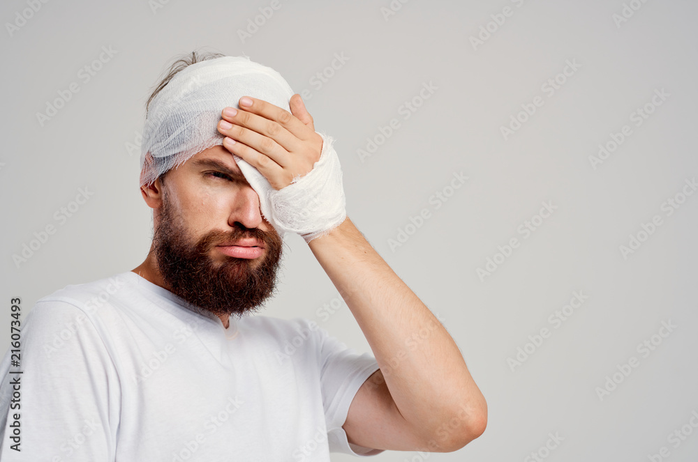 a man with a bandage on his head a man with a bandage on his head