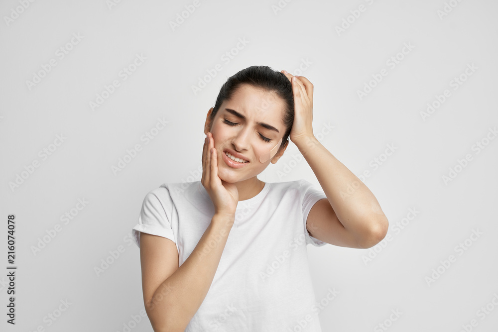 woman with eyes closed holding cheek sore teeth woman with eyes closed holding cheek sore teeth