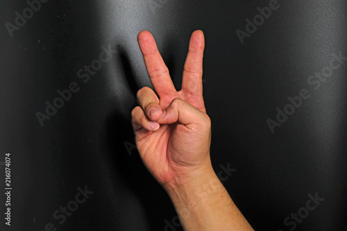 Man hand sign isolated on back background