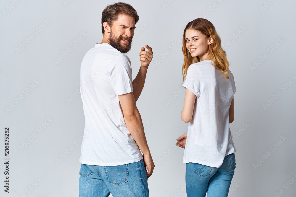 young couple in white t-shirts logo emotions young couple in white t-shirts logo emotions