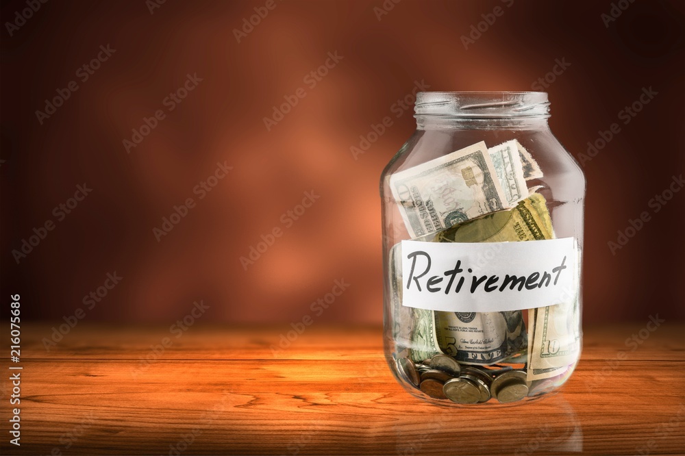 Coins in glass money jar on background Coins in glass money jar on background