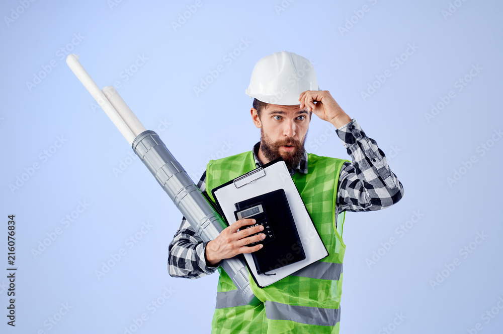architect with documents in hands in a white helmet architect with documents in hands in a white helmet