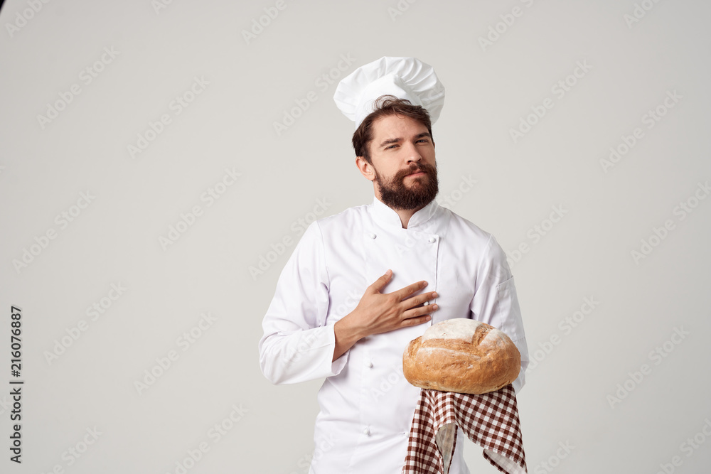 chef with a round loaf of bread in his hand chef with a round loaf of bread in his hand