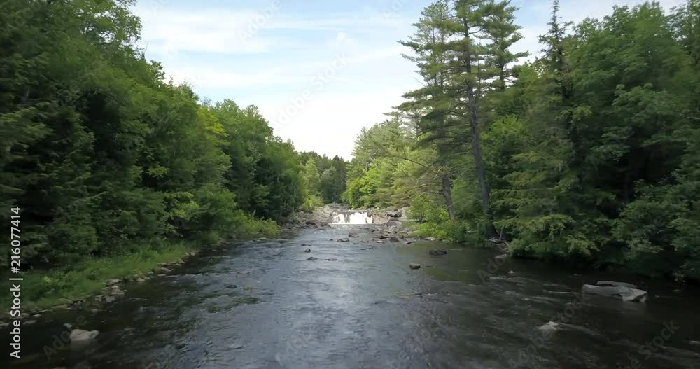 Flying upstream towards a small waterfall at Tobey Falls, Maine. Flying upstream towards a small waterfall at Tobey Falls, Maine.