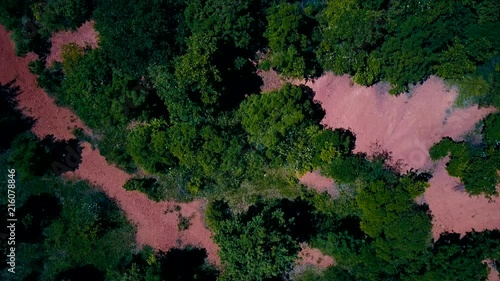 Wallpaper Mural aerial drone footage of an abandoned bauxite mine in the middle of the forest next to a small town in europe Torontodigital.ca