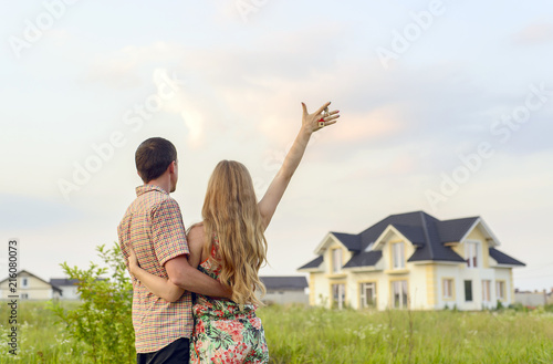 couple looking on house