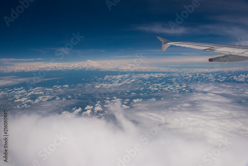 View of the sky full of clouds from the window of an airplane. Colombia