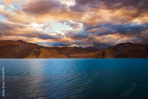 Blue water at Pangong lake with colorful cloudy sky