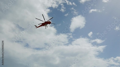 During the wildfires in Attica Greece. View of the smoke from the highway and Skycrane helicopter firefighting.