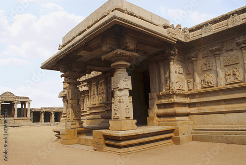 The side, south, porch of the ardhamandapa and the bas-reliefs on the outer wall depicting the scenes from the Ramayana. photo