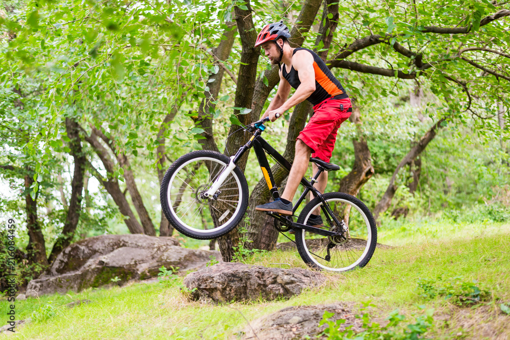Extreme cycling, a cyclist jumping on a mountain bike. Extreme cycling, a cyclist jumping on a mountain bike.