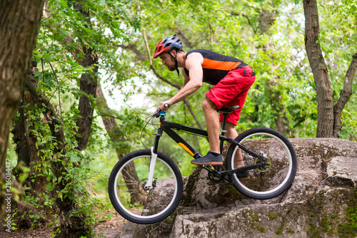 Fototapeta Naklejka Na Ścianę i Meble -  Extreme cycling, a cyclist jumping on a mountain bike.