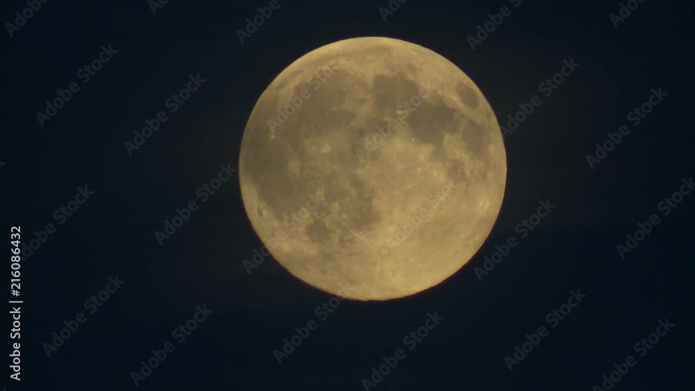 Yellow full moon sits against a dark blue sky. This was the second full moon in July 2015. Yellow full moon sits against a dark blue sky. This was the second full moon in July 2015.