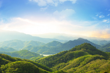 Earth day concept: Beautiful natural scenery of river in southeast Asia tropical green forest with mountains in background
