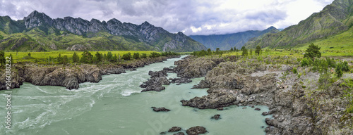 Panorama of mountain summer landscape of fast river Katun with Teldykpen rapids, Altai mountains, Russia. This is the narrowest and deepest place of river - harsh beauty of nature 
