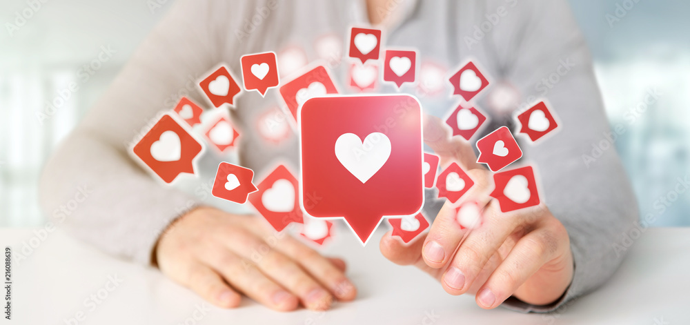 Businessman holding Like notification on a social media 3d rendering Businessman holding Like notification on a social media 3d rendering