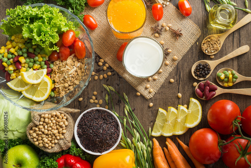 Healthy food background  fruits and vegetables with salad bowl on wooden table.