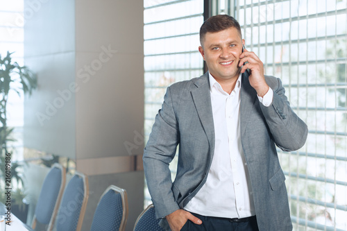 Handsome smiling confident businessman portrait