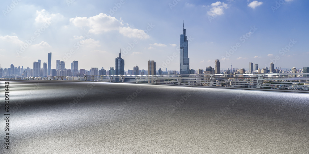 Fototapeta premium Panoramic skyline and modern business office buildings with empty road,empty concrete square floor