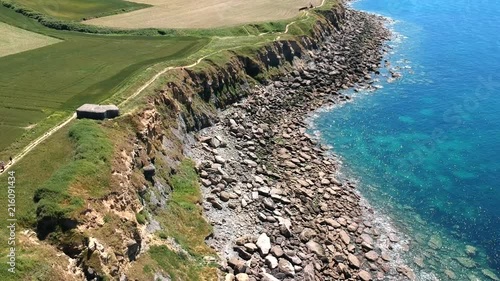 Drone footage of the cliffs, rocks and sea of Cap Gris-Nes, France. photo