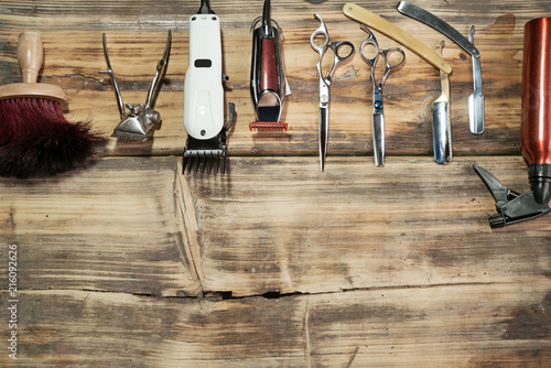 Tools for barber on wooden table closeup