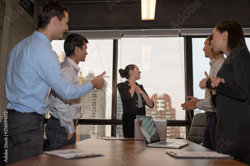 Business partners clap them hand after complete a deal. Business Team Achievement Success Mission Concept.