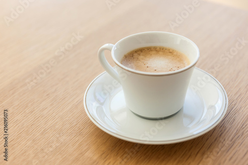 espresso coffee with cup and saucer on the wood table