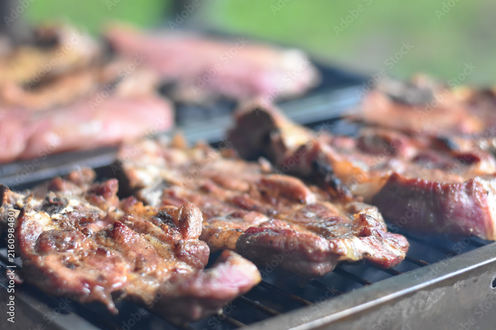 Cooking meat on a grill. Delicious fresh meat on a barbeque