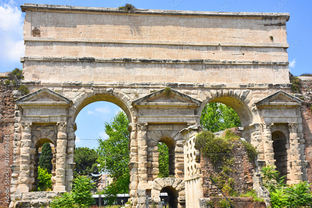 Rome, Porta Maggiore with the ancient aqueduct on it. View and detail