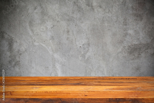 Empty wood Shelf on concrete wall background