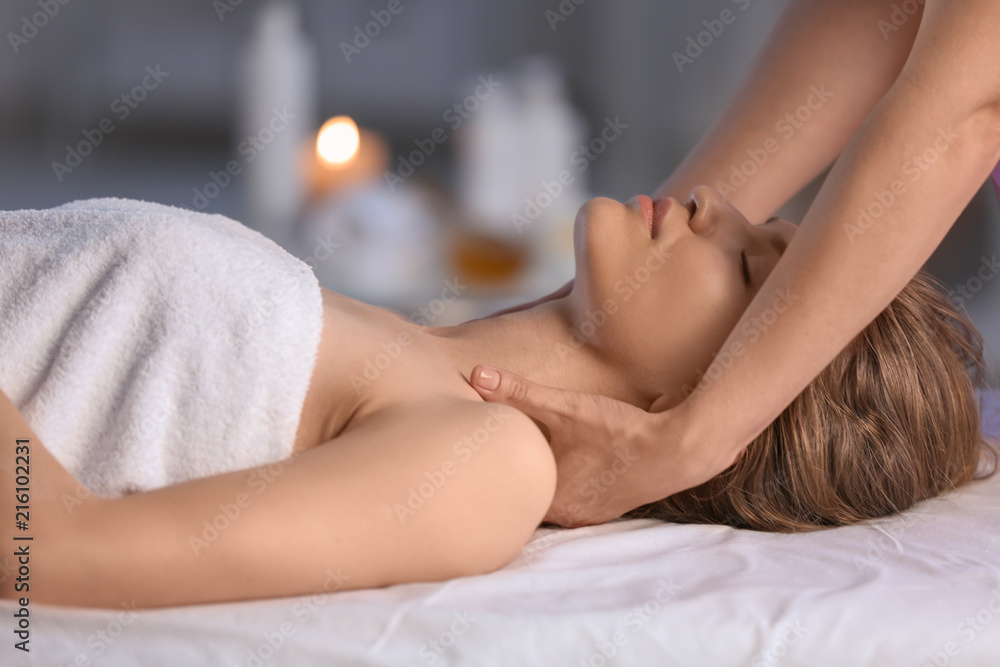 Obraz premium Young woman having massage in beauty salon