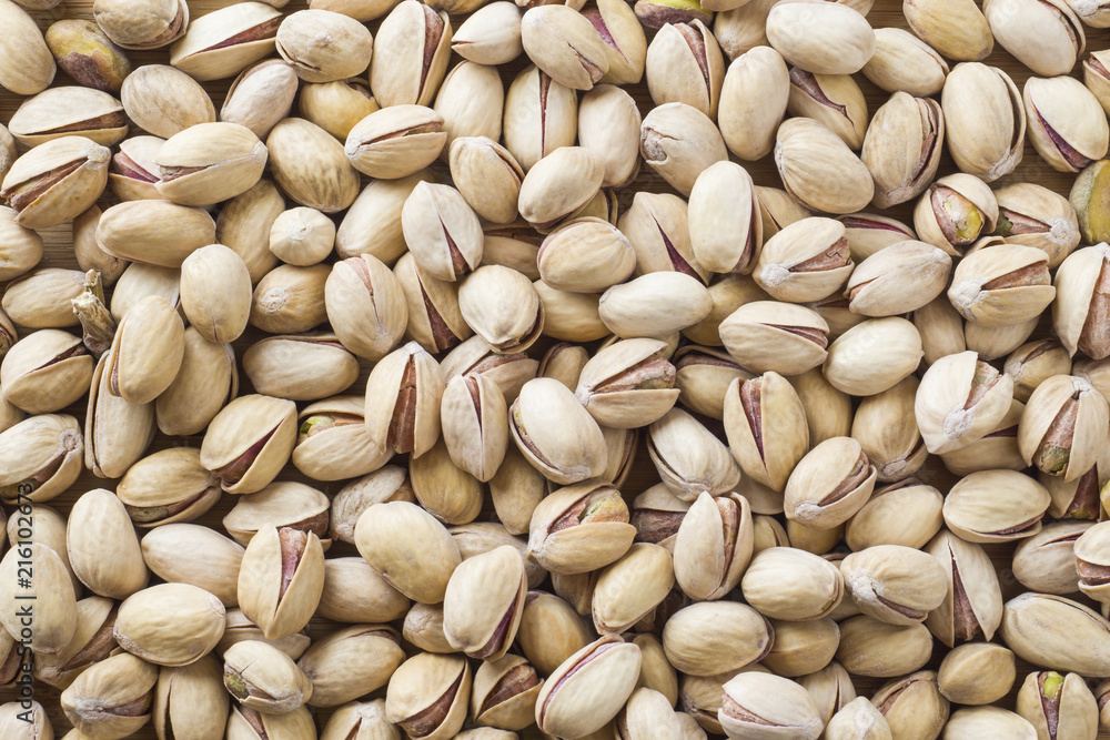 Salty pistachios nuts Background of the full population. Salty pistachios nuts Background of the full population.