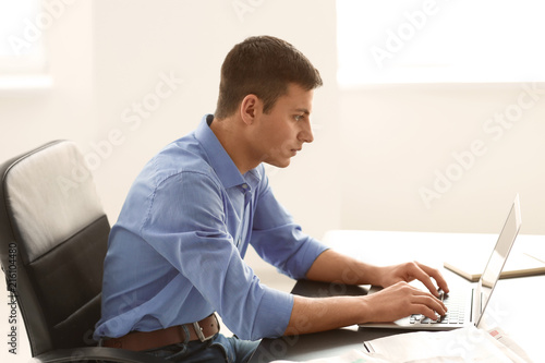 Young businessman reading n...