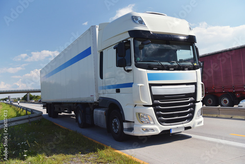 LKW zum Warentransport auf der Autobahn // truck for shipping of goods on highway © industrieblick