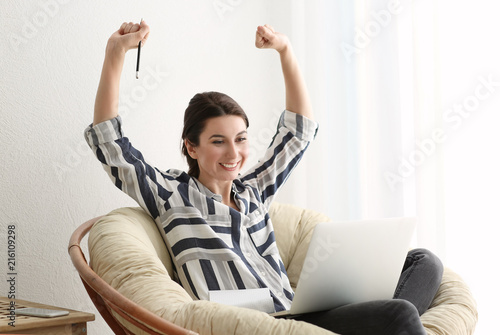 Happy female freelancer wit...