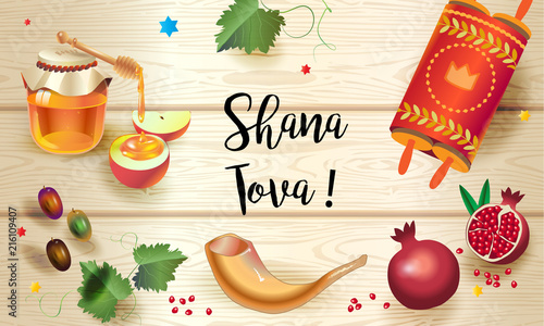 Rosh Hashanah greeting card - Happy Jewish New Year Text "Shana Tova!" on Hebrew. Honey and apple, shofar, pomegranate, Torah symbols on wood plank. Rosh hashana, sukkot Holiday