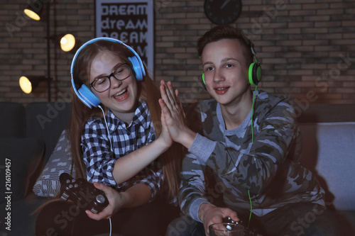 Teenagers playing video gam...