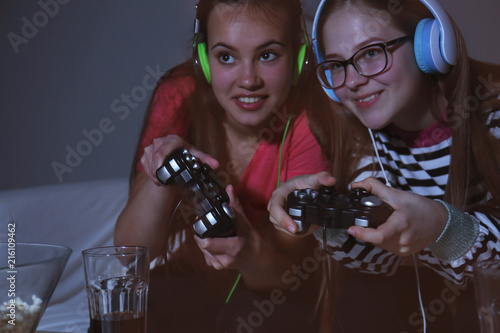 Cute girls playing video ga...
